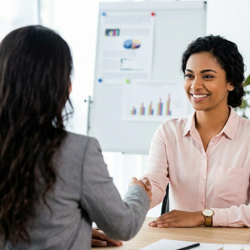 recruiter-smiling-and-shaking-hands-with-employee-at-job-interview-in-office
